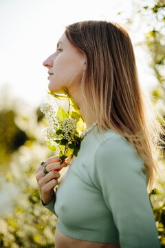 Spring portrait of woman with flower