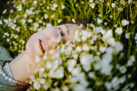 Relaxed woman lying on grass - Natural portrait 
