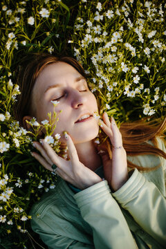 Summer portrait of woman in flowers