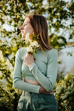 Woman portrait in blossom garden