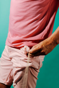 man emptying the sand of his pocket