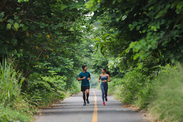 Obraz premium They are an Asian couple jogging and exercising.