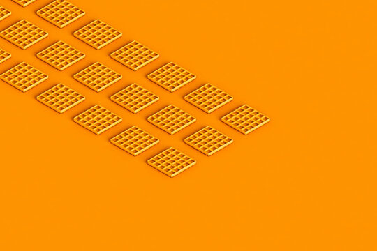 rows of orange waffles with copy space