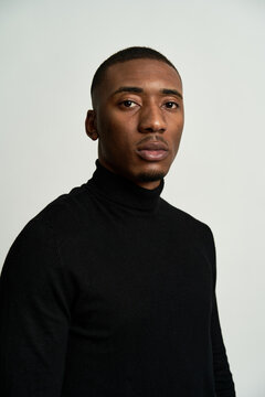 Self assured man in stylish black turtleneck