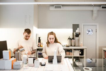 A young team of baristas in a coffee shop