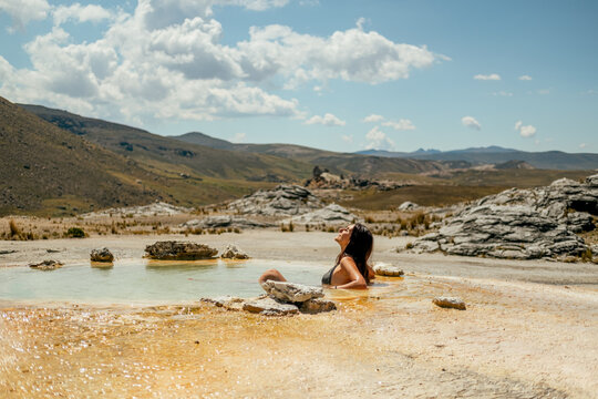 woman in an outdoor hot spring
