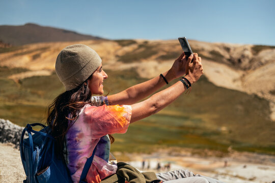 woman taking a selfie in nature