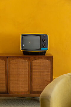 Vintage Seventies Analog Television on sideboard cabinet 