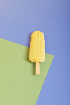 Yellow popsicle on a background