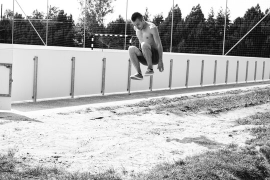 Athletic long jumping man