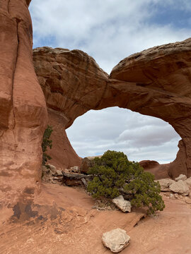 Photo of the Broken Arch in the Broken Arch Trail from Sand Dune Arch trailhead in Arches National Park located in Moab, Utah, United States USA