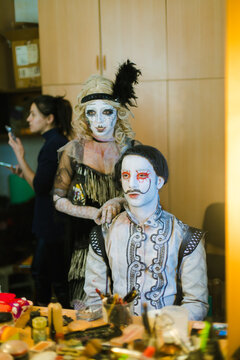 An actor and an actress practice their roles in front of the mirror