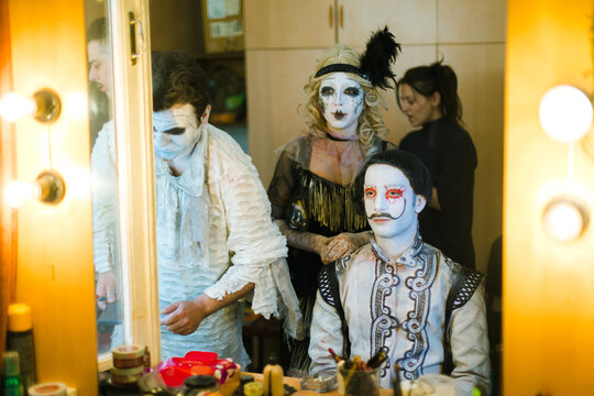 An actor and an actress practice their roles in front of the mirror