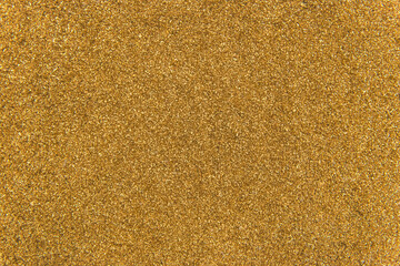 Golden yellow metal shavings waste steel recycling iron texture background