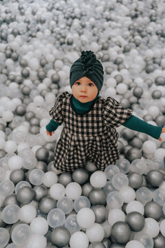 Toddler in ball pool