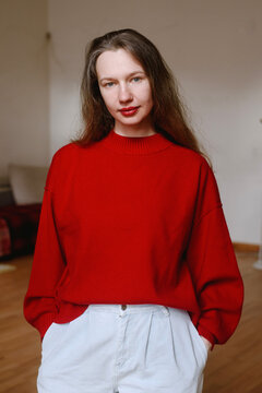 Portrait of a woman wearing red sweater