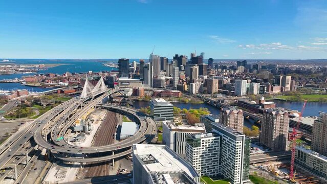 Boston downtown financial district skyline and Leonard Zakim Bridge aerial view, with Boston Harbor and Charles River at the background, Boston, Massachusetts MA, USA. 