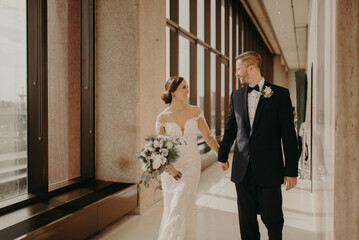 A bride and Groom posing for pictures