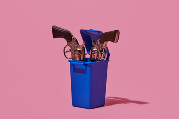 toy guns thrown into the waste container