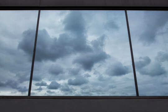large window view of a cloudy sky