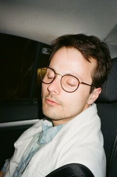 handsome tired man in taxi