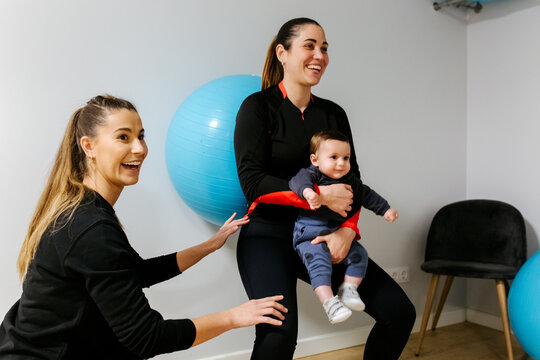 Mother and baby attending a postpartum recovery class