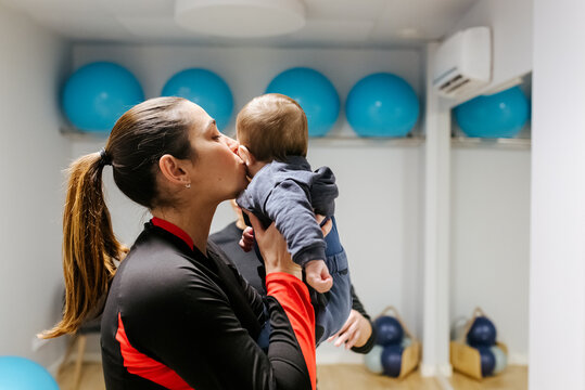 Mother and baby attending a postpartum recovery class