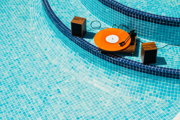 Vinyl player in an empty swimming pool