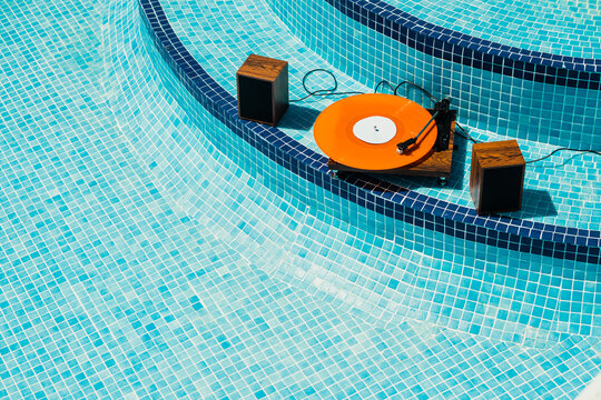 Vinyl player in an empty swimming pool
