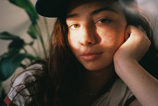 User-generated content freckled teen girl resting on living room