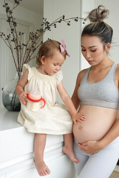 Pregnant Mum And Daughter