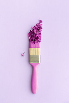 Paintbrush with lilac flowers