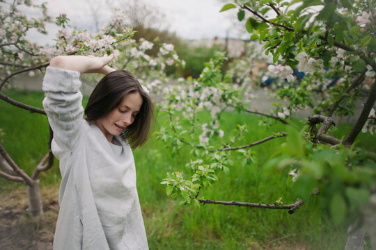 contemporary dancer dancing in a blossom garden