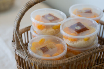 Tongyib sweets, Thong Yod, packed in a clear plastic box.