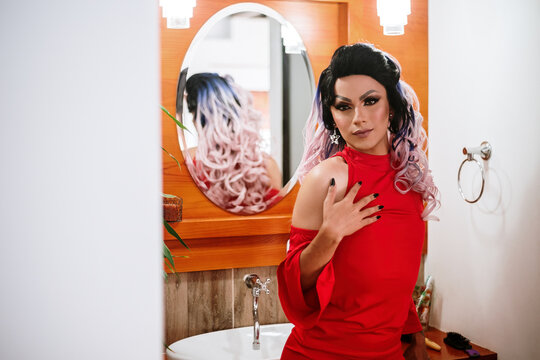 Man dressed as a woman in the bathroom