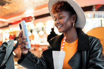 Cool woman drinking a smoothie