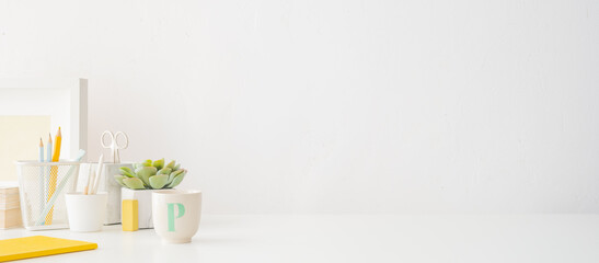 Home office, creative desk with office supplies. Bright and minimal workspace.