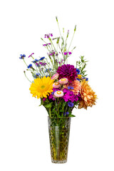 Beautiful bouquet of vibrant colored fresh flowers in a crystal vase isolated on white with a shallow depth of field