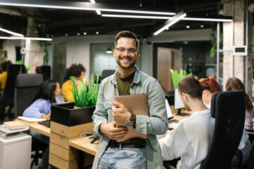 Young Businessman Holding A Laptop