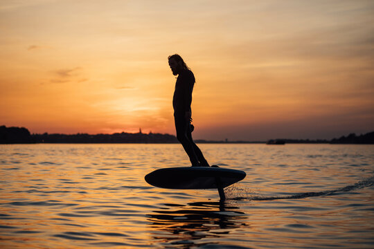 Surfer e-foil  sunset 