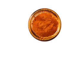 Paprika powder in a wooden bowl - Capsicum annuum