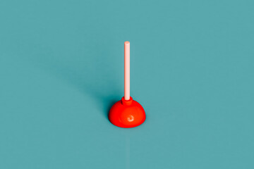 a red plunger on a blue background
