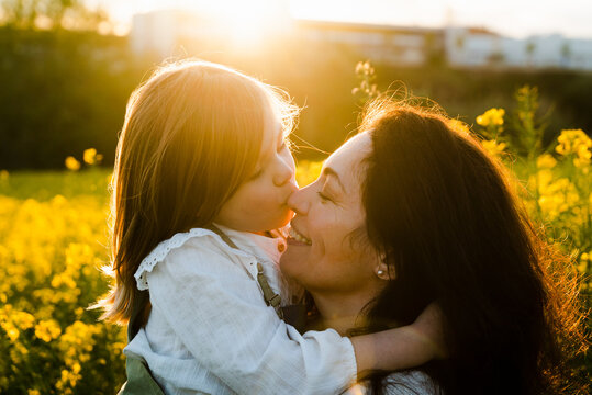 Daughter Kissing Her Mom