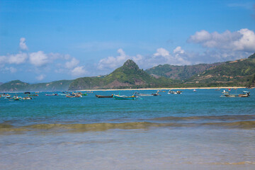 Fototapeta na wymiar the beautiful scenery at Selong Belanak beach with clear sky and blue sea water