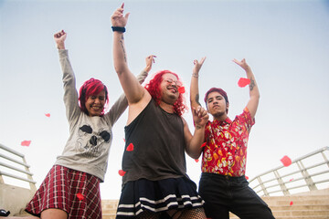 Transgender friends dancing in the street