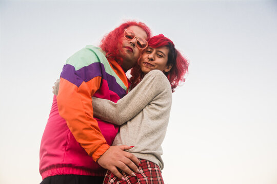 Trasngender woman and non-binary person hugging each other