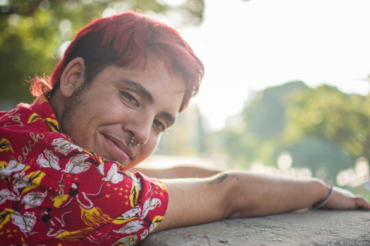 Transgender man looking seductively at camera
