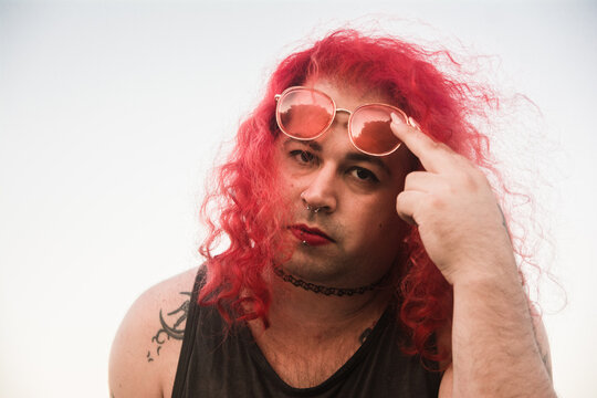 Trans woman with pink glasses