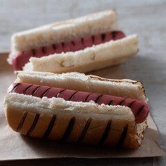 two hot dogs without dressings