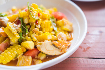Papaya salad with corn or in Thai called Som Tum Khao Pod with salted egg